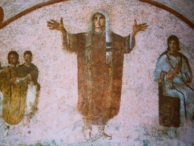 painting from catacombs of a woman praying